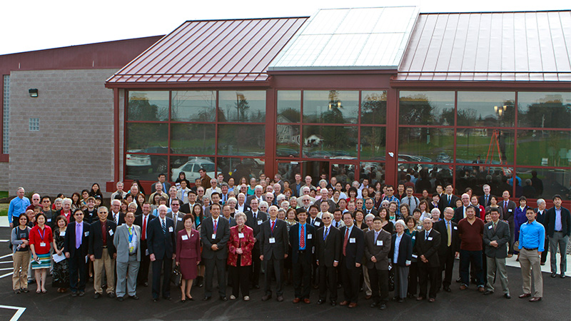 Outdoor photo of large group of staff and volunteers